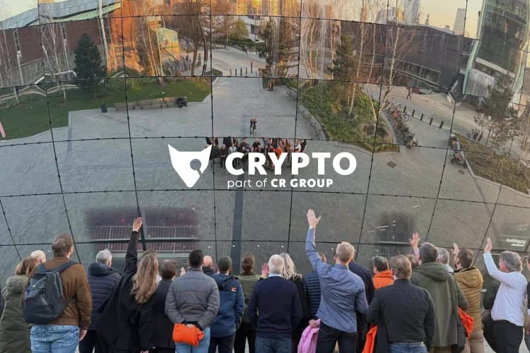 Group of Fox Crypto DataDiode partners waving at a reflective mirror installation during the 2025 partner event in Rotterdam